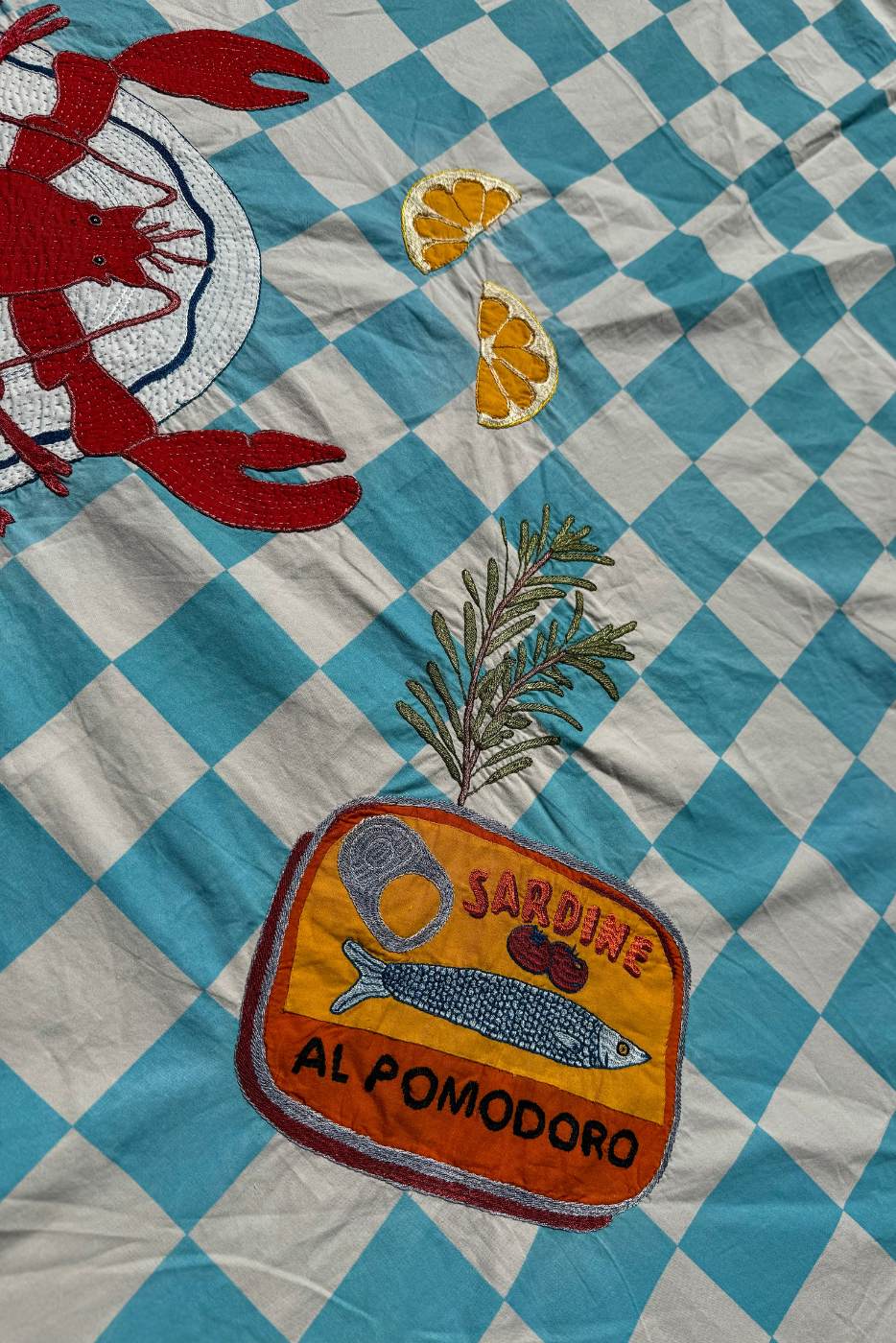 close up of block print embroidered tablecloth 