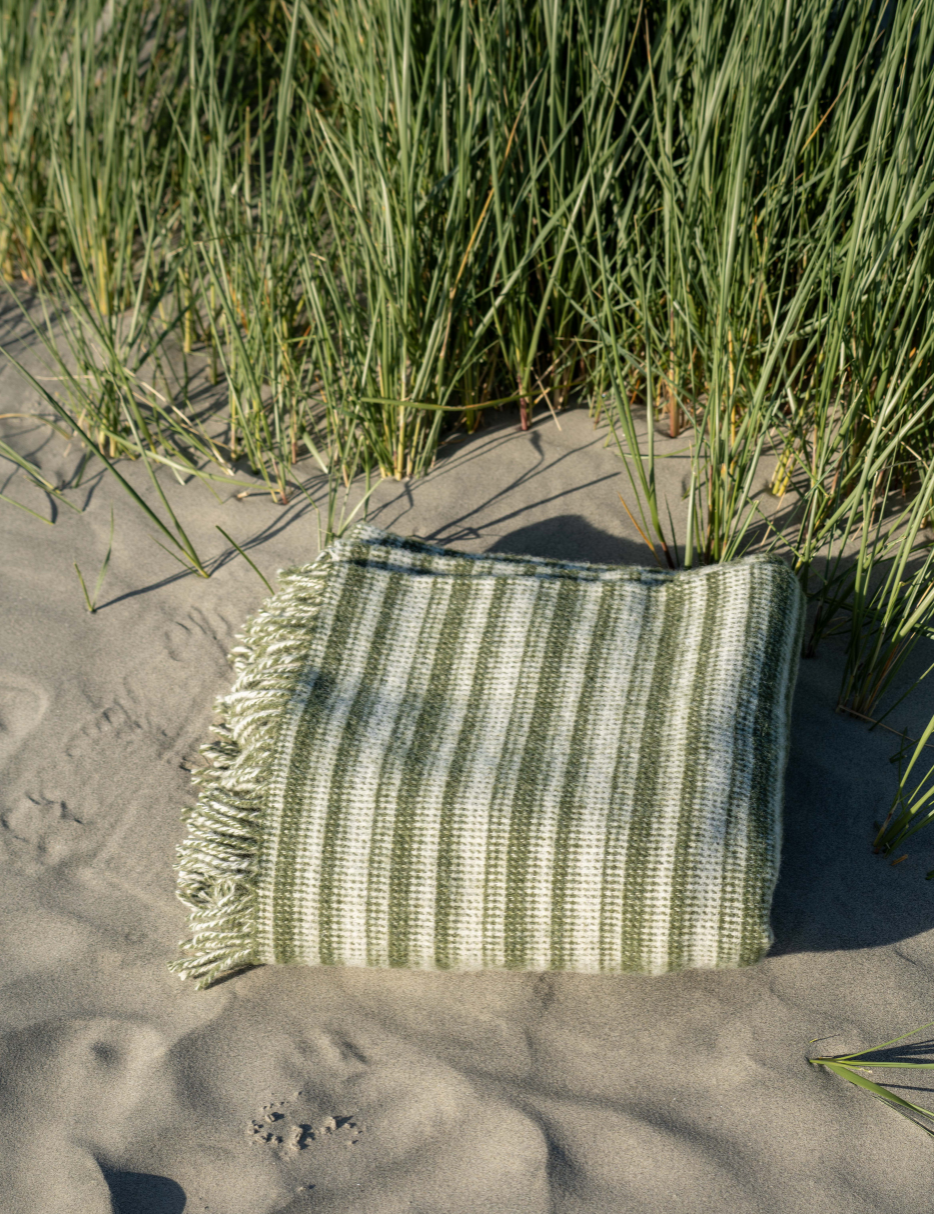 green and cream striped wool blanket  