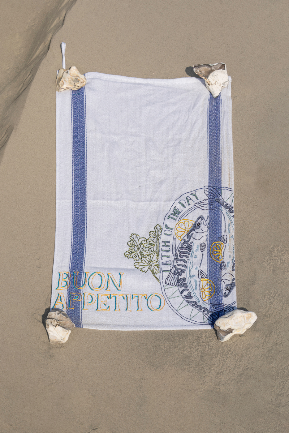 mediterranean buon appetito hand embroidered tea towel with fish