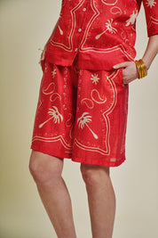 patterned red and natural shirt