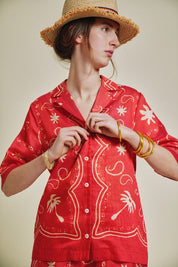 patterned red and natural shirt